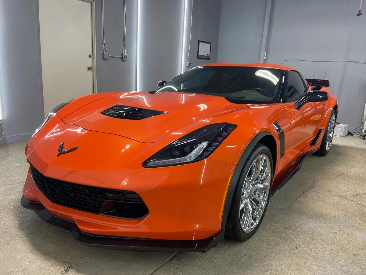 Orange Chevrolet Corvette in the workshop